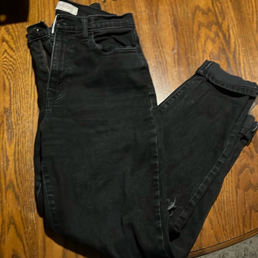 Barely worn women’s black high rise jeans with knee rips